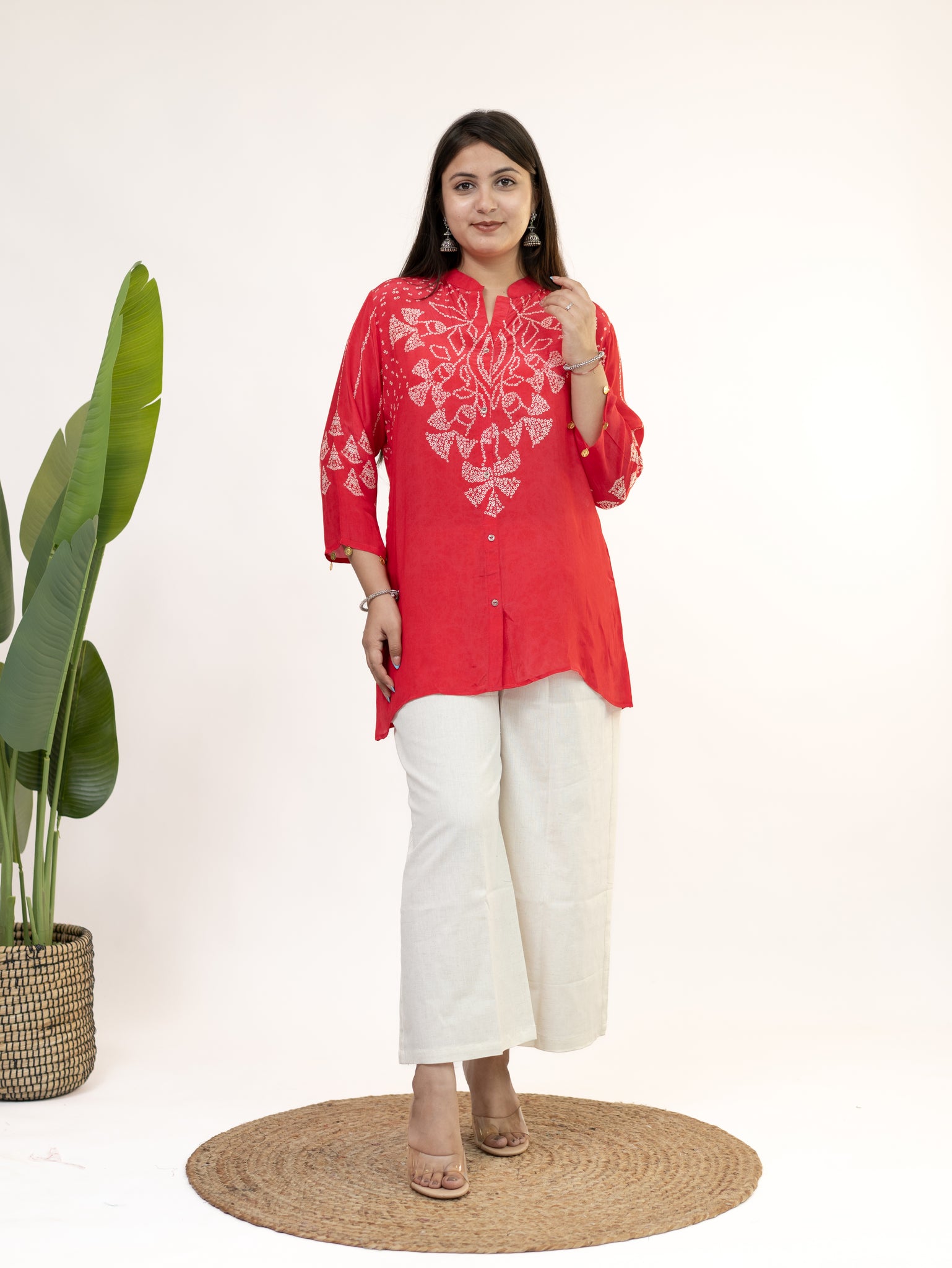 Red kurti paired with white pants