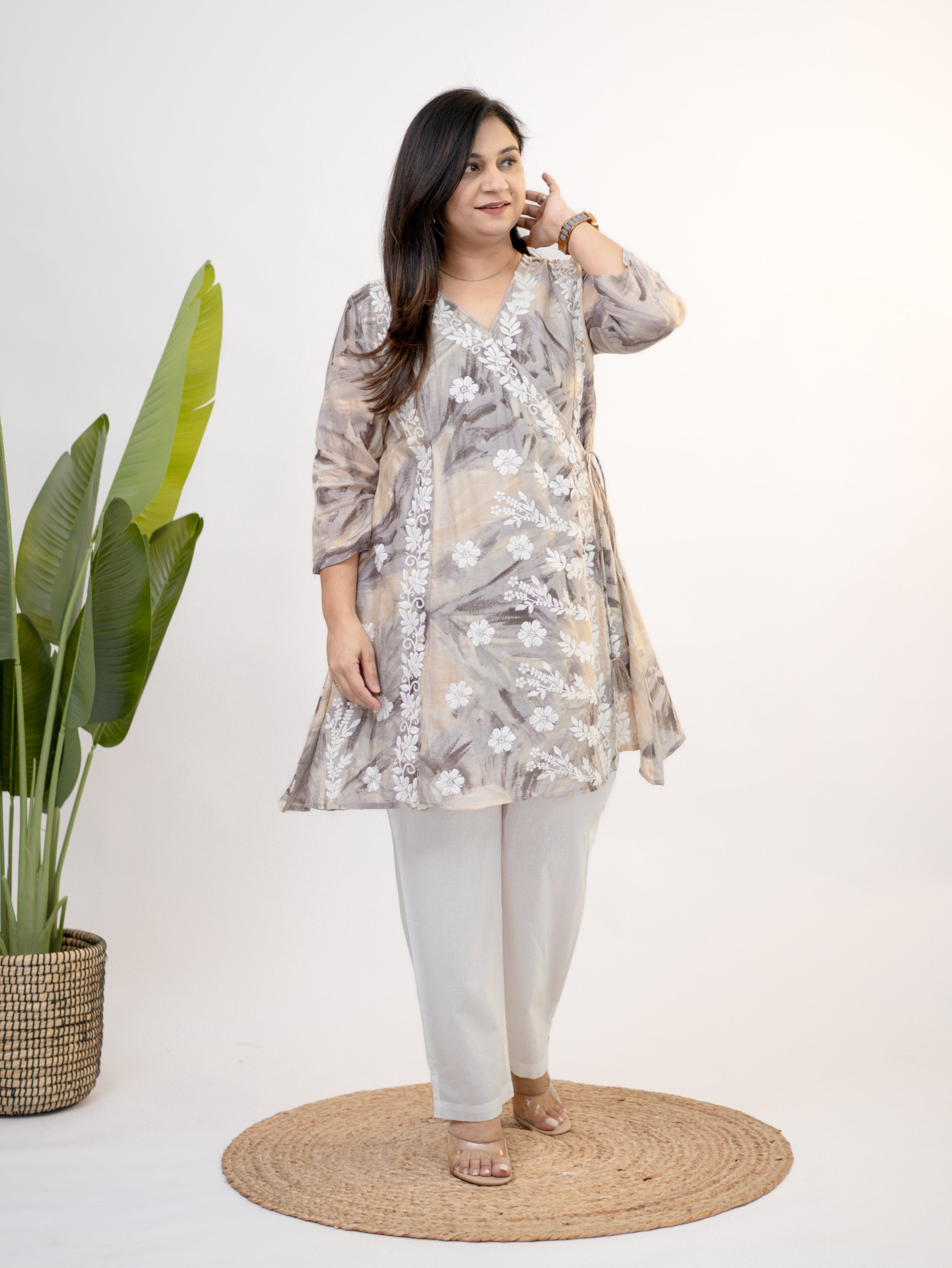 Fara mul cotton chikankari work A-line coord set side pose with white pants and soft beige print