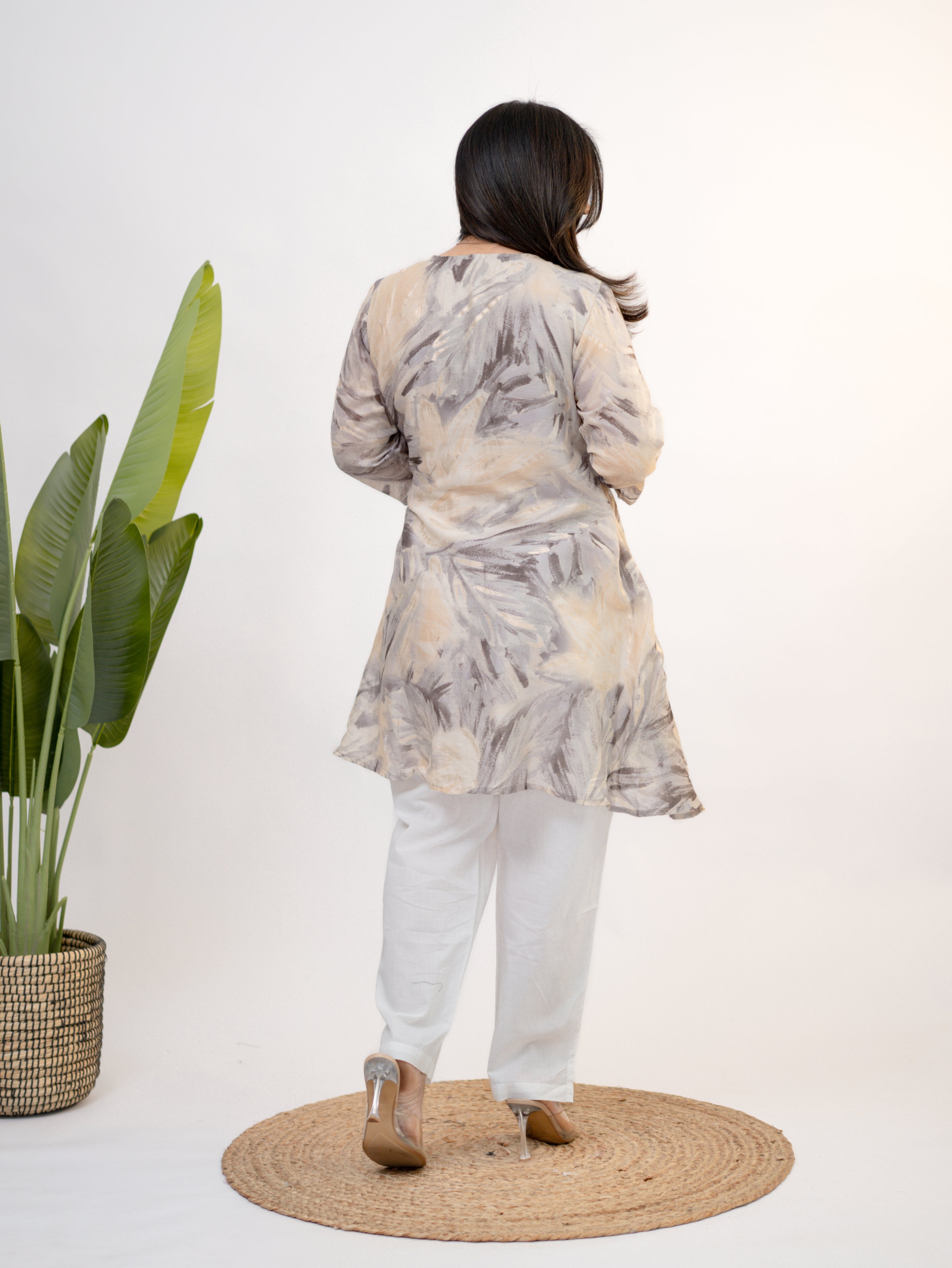 Close-up of Fara mul cotton chikankari work A-line coord set with floral embroidery and tassel tie-up