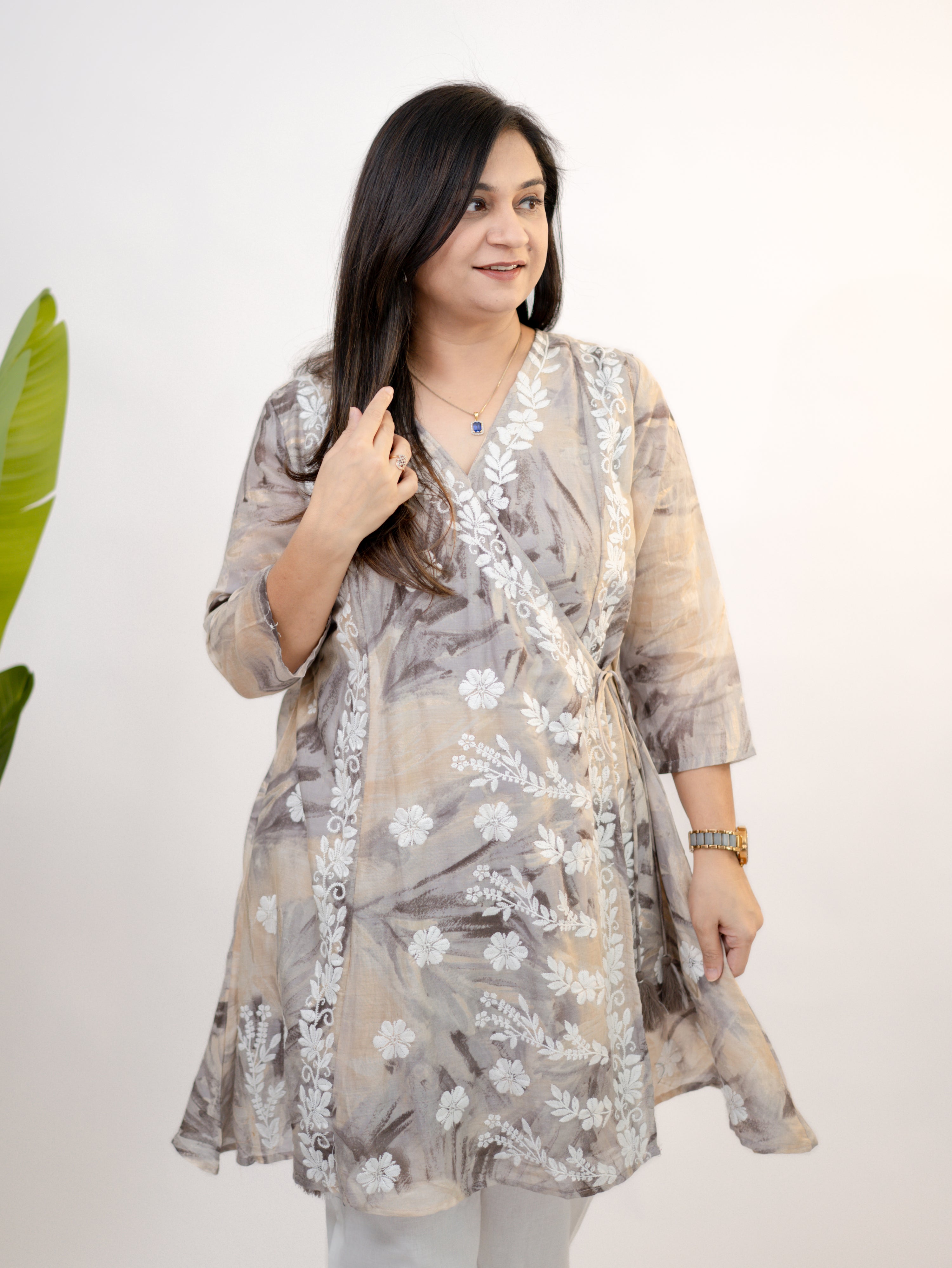 Close-up sleeve and neckline detail of Fara mul cotton chikankari work A-line coord set